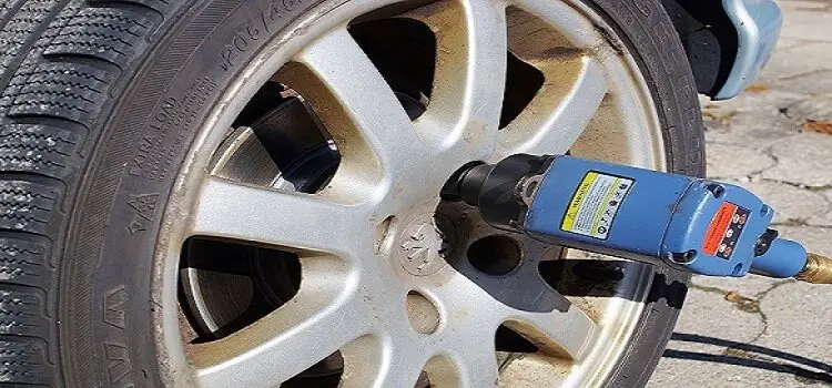 removing lug nuts from tires using impact wrench 