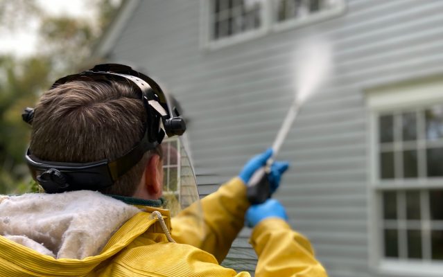 best pressure washer for 2 story house man cleaning house